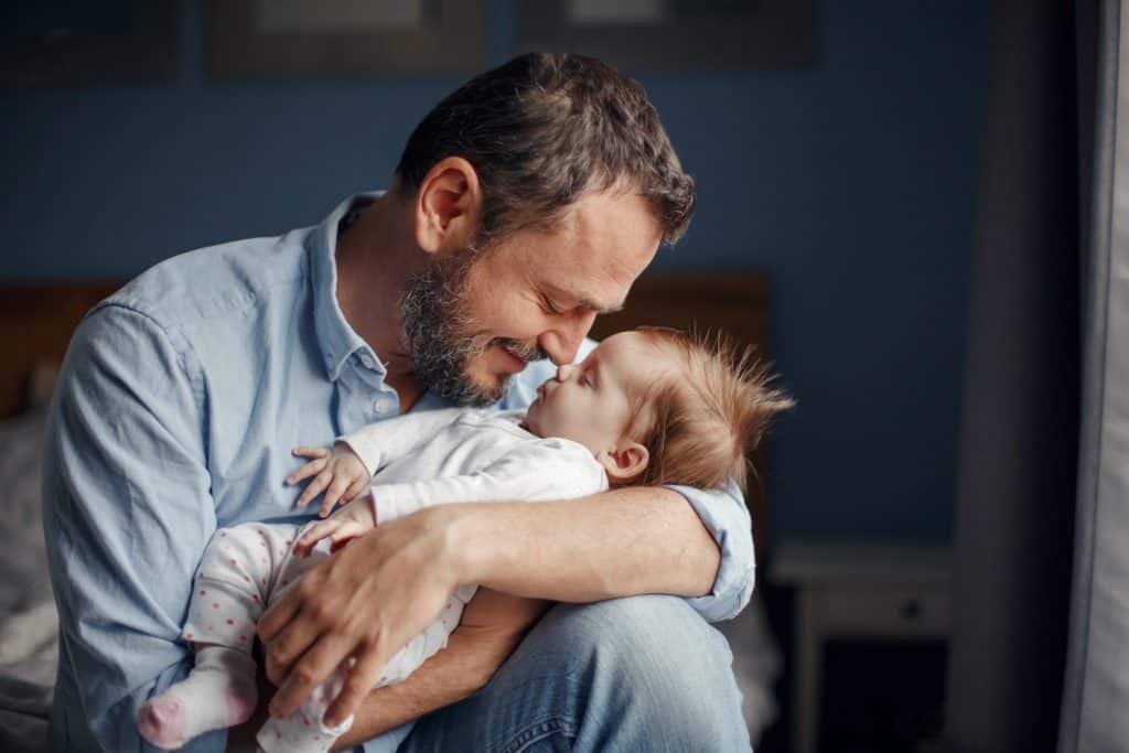 father nose to nose with son