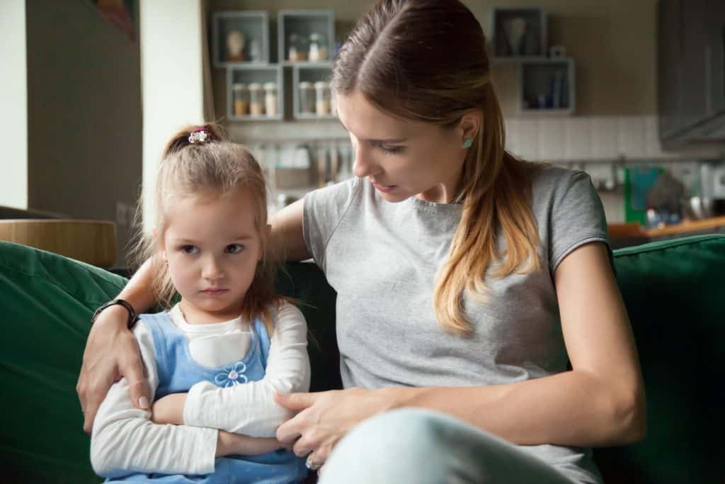 mom comforting daughter throwing tantrum