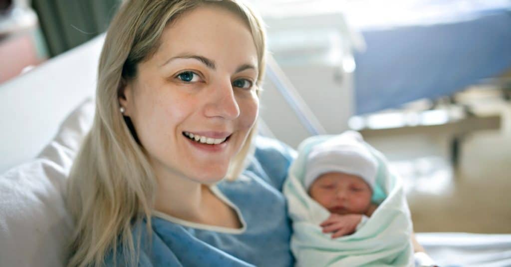 mom holding baby