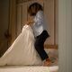 woman making her bed