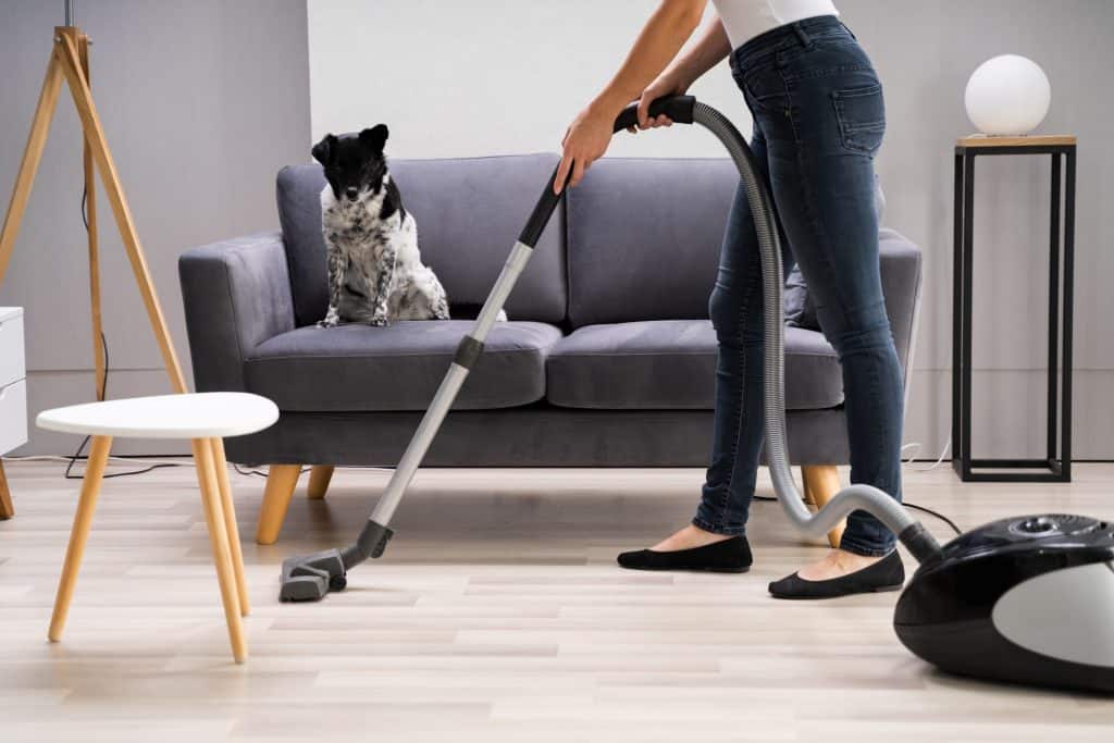 woman vacuuming the floor