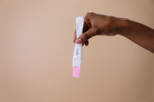 holding pregnancy test