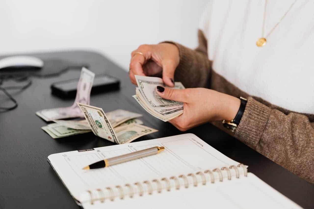 woman computing money