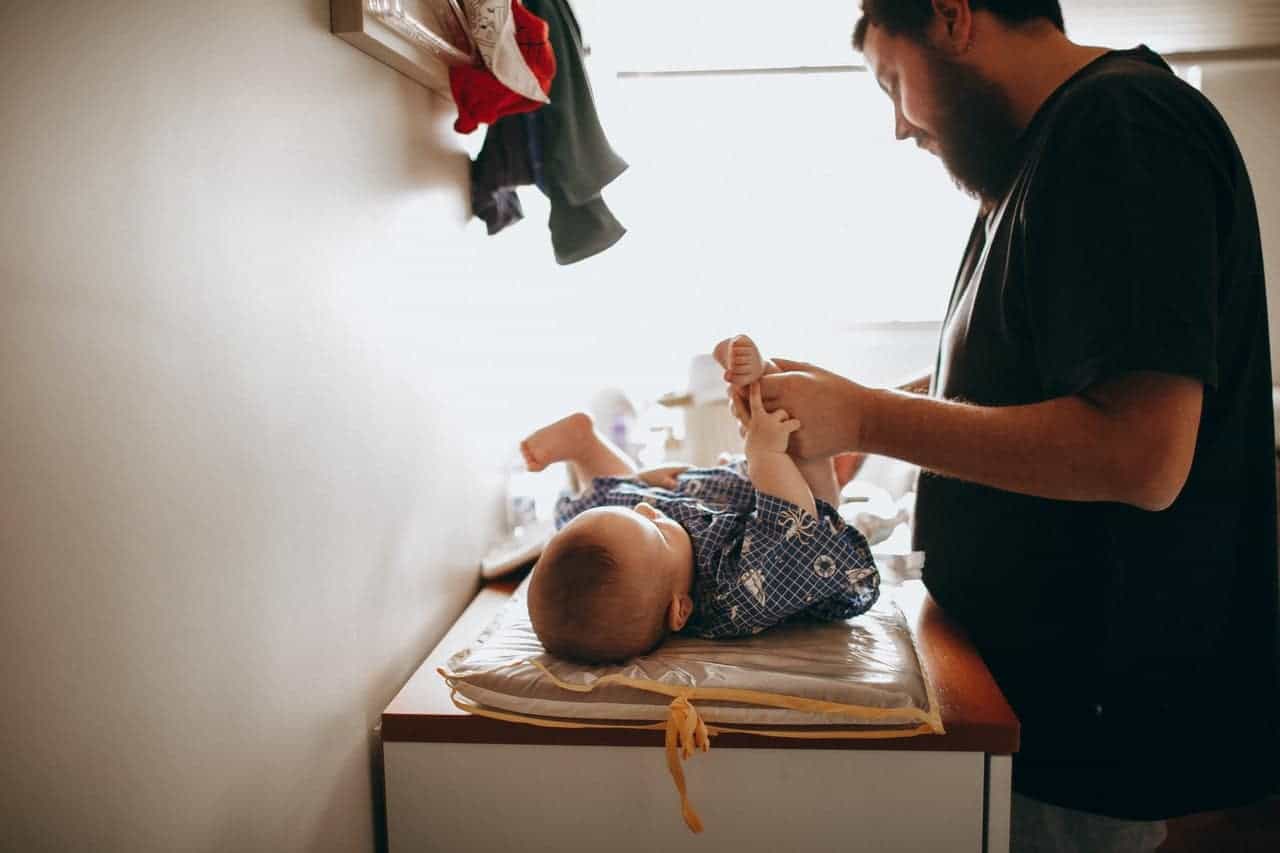 dad changing diaper