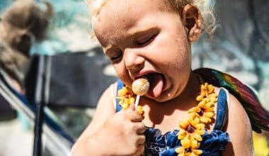 baby eating lollipop