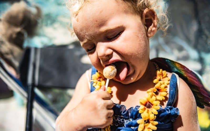 baby eating lollipop