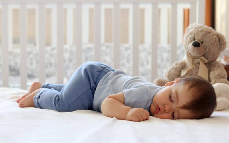 baby sleeping on knees