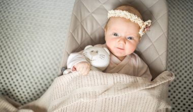 cute baby lying on a baby lounger
