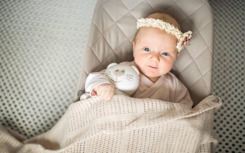 cute baby lying on a baby lounger