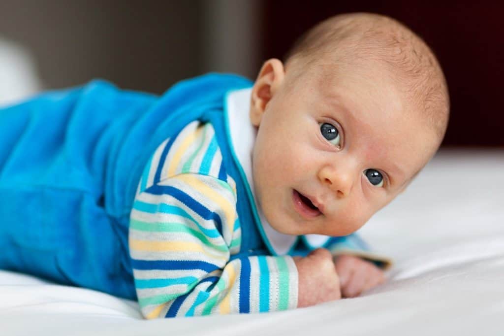 cute baby wearing blue onesies