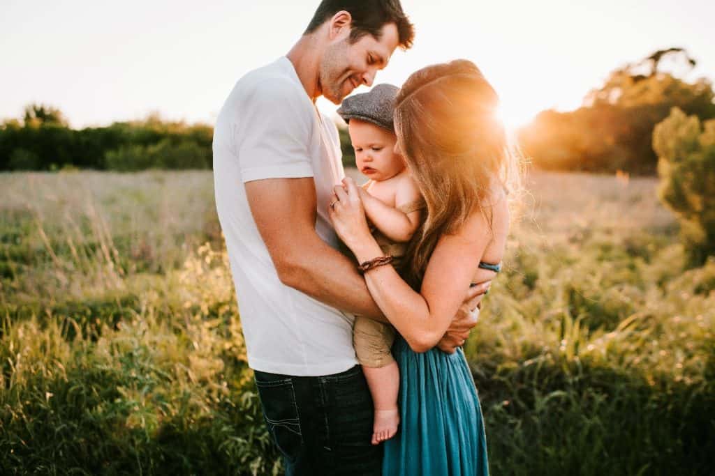 family on a field of grass