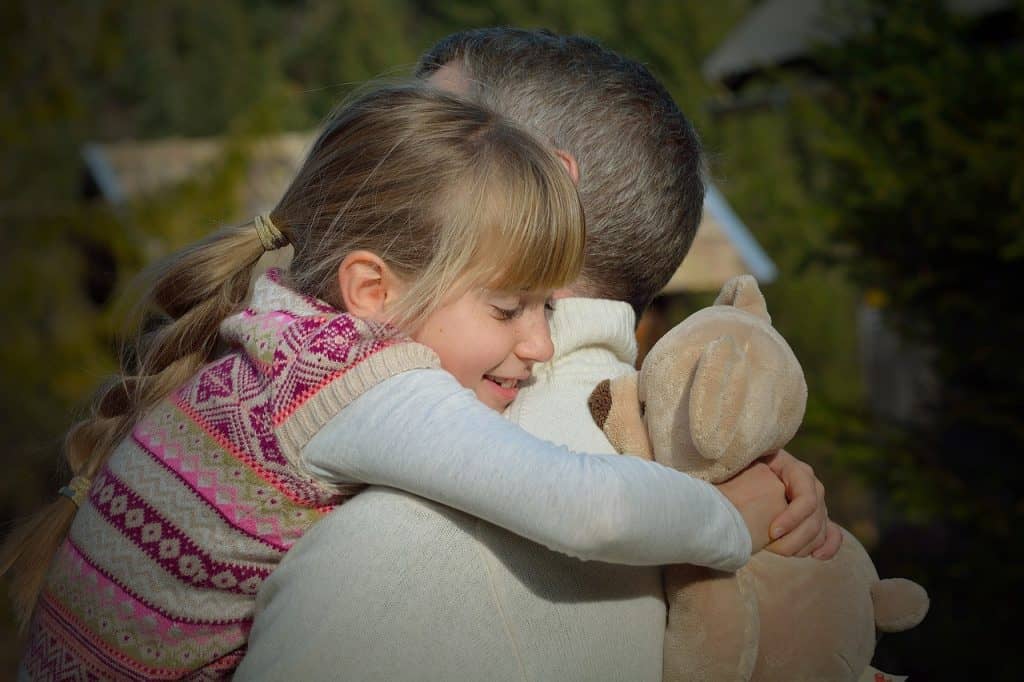 girl hugging dad