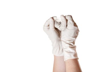 gloved hands holding nipple shield
