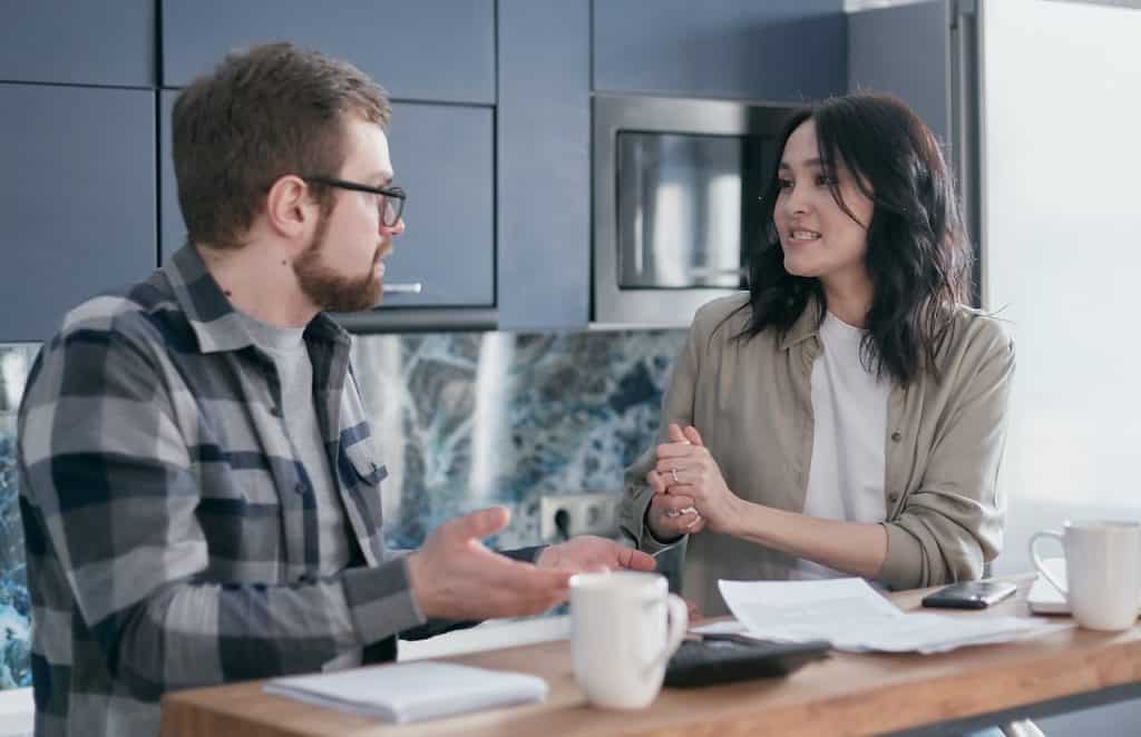 man and woman talking at each other