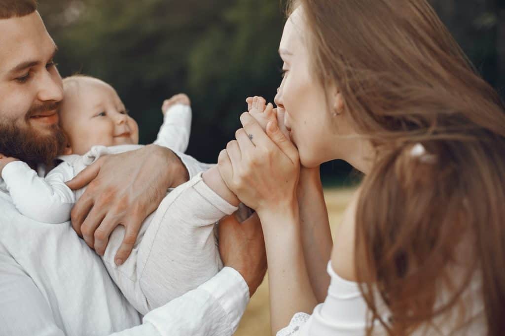 mom kissing baby's feet