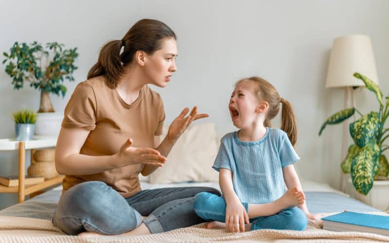 mom scolding crying child