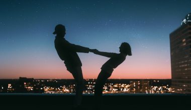 silhoutte of couple holding each other's hand