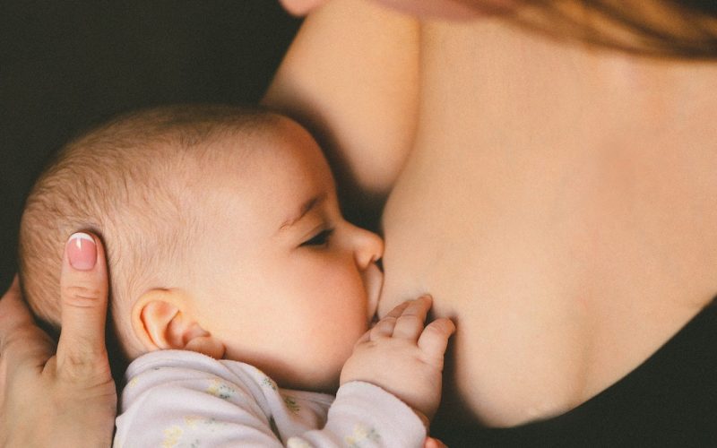 woman breastfeeding baby