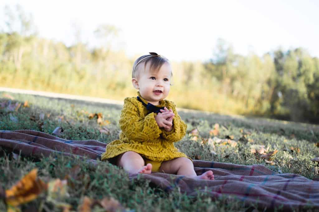 baby girl wearing yellow dress