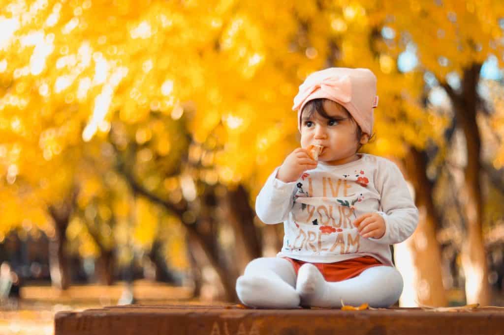 baby sitting on top of a table