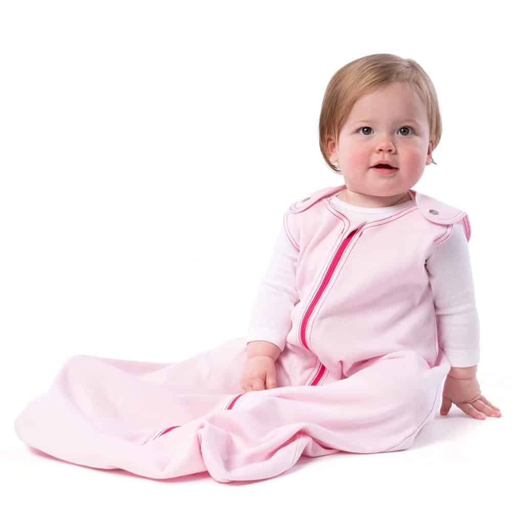 baby wearing pink sleep sack