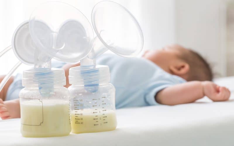 breastmilk beside sleeping baby
