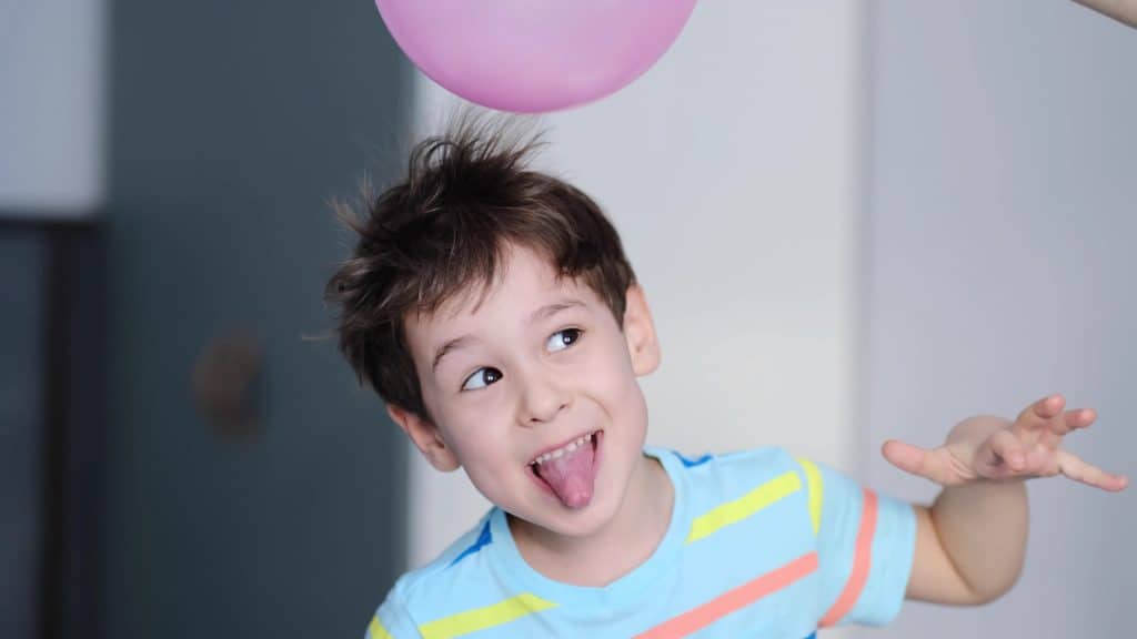 cheerful boy with tongue out