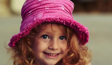 cute girl wearing a pink hat
