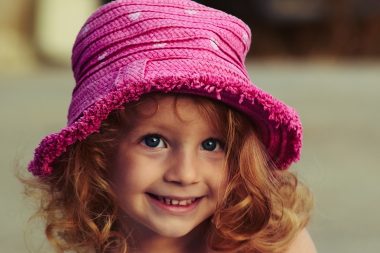 cute girl wearing a pink hat