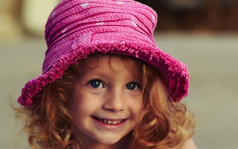 cute girl wearing a pink hat