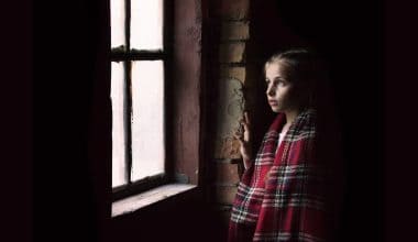 girl looking out the window