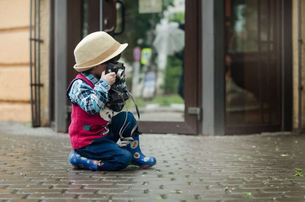 little boy taking a picture