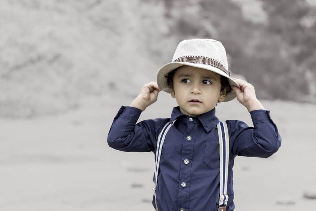 little boy wearing vintage clothes