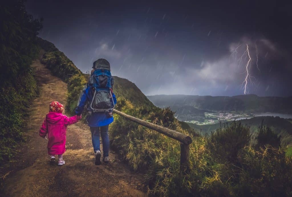 mother and children walking on a trail