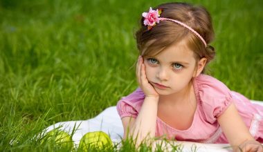pretty girl sitting on grass