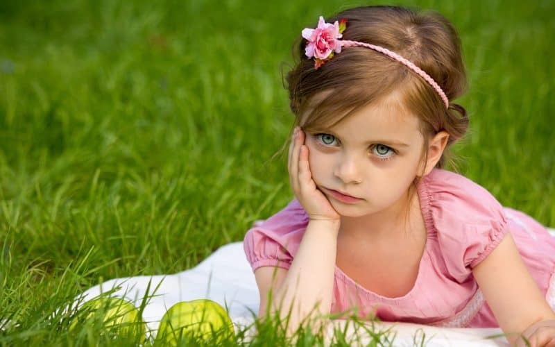 pretty girl sitting on grass