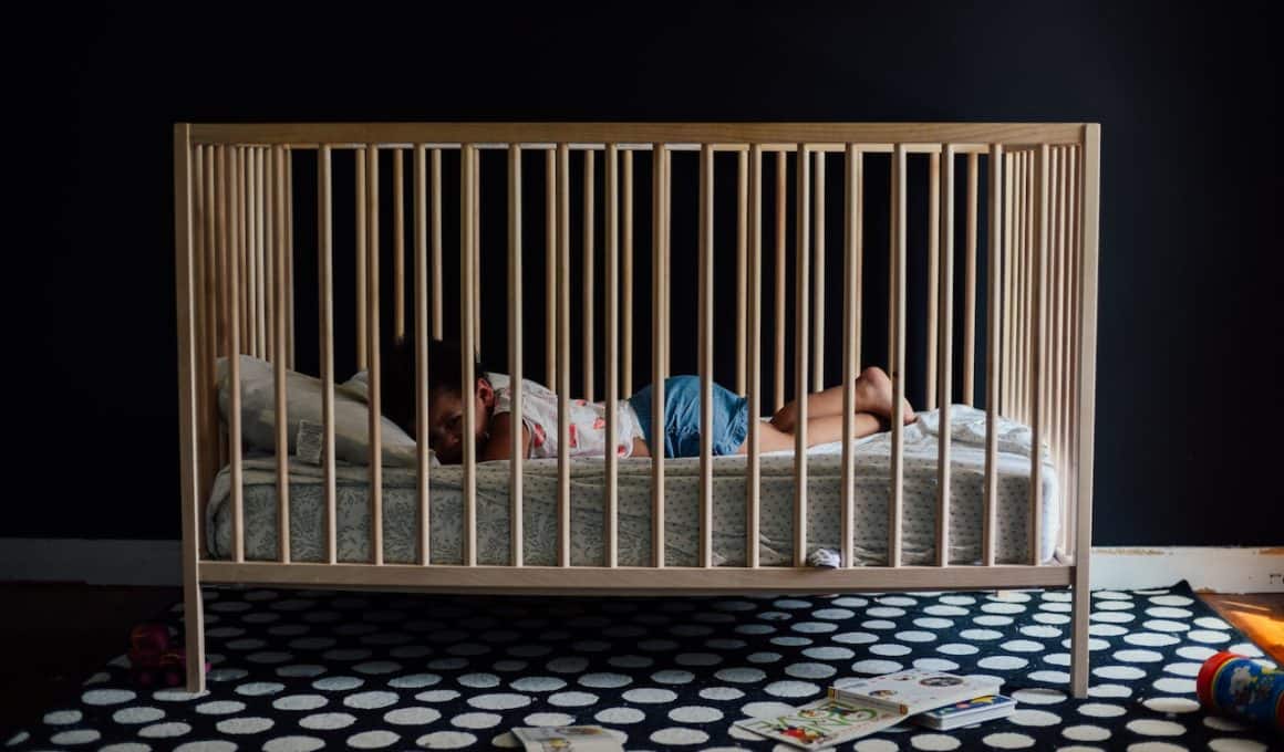 toddler on a crib
