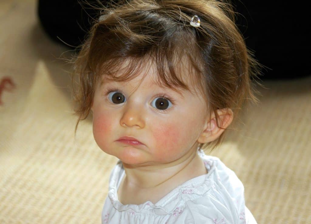 wide-eyed cute little girl