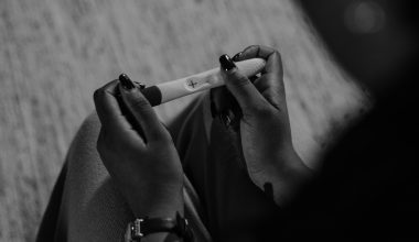 woman looking at result of pregnancy test