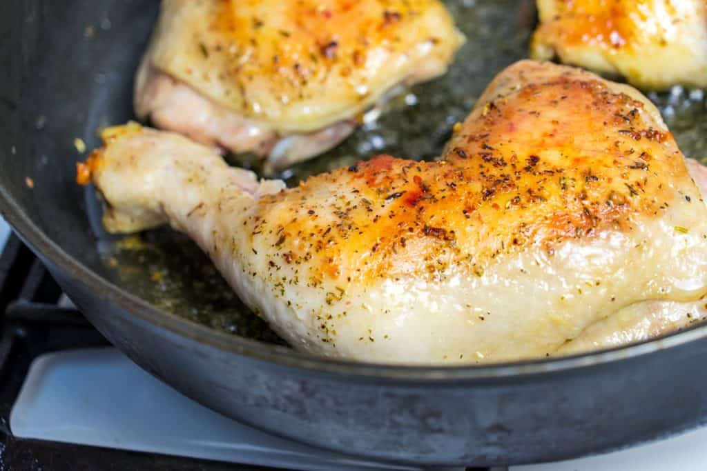 chicken frying on pan