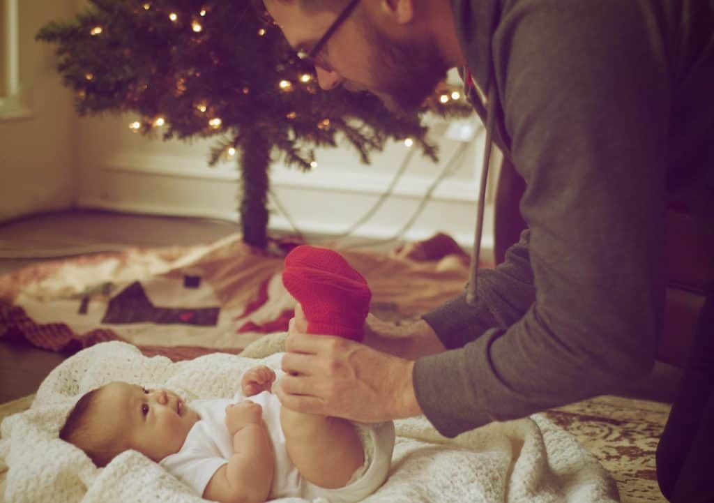 dad entertaining baby