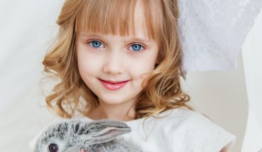 girl holding a rabbit
