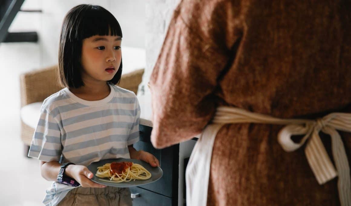 girl holding spaghetti