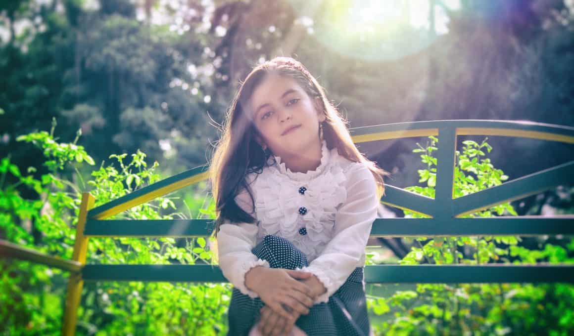 girl sitting on a bench