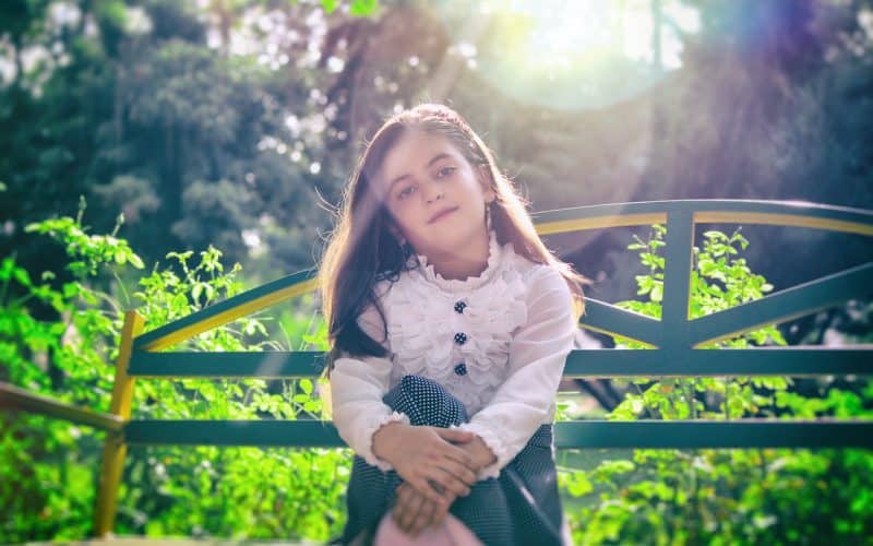 girl sitting on a bench