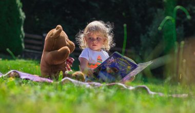 girl sitting with teddy bear