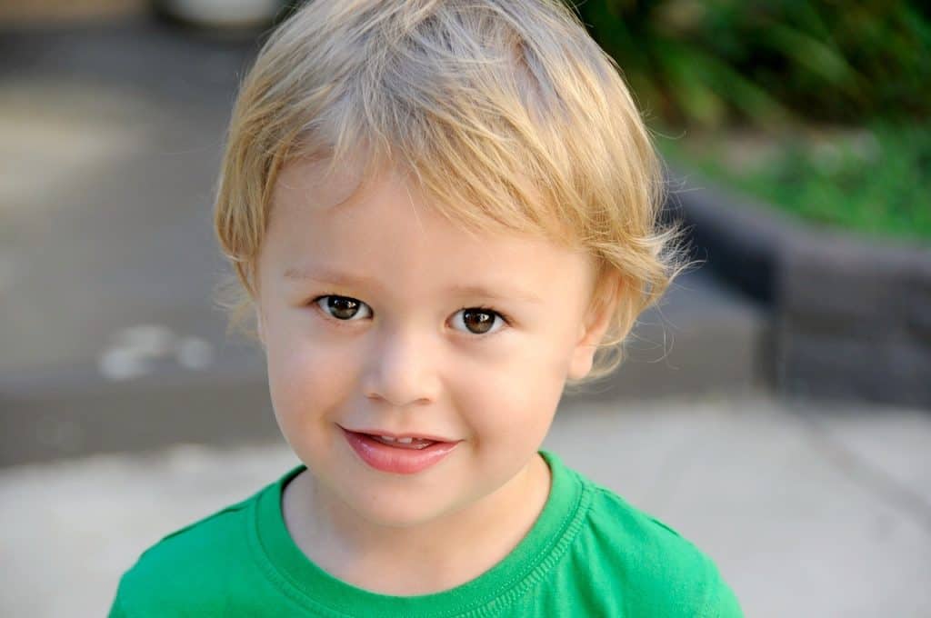 little boy wearing green shirt