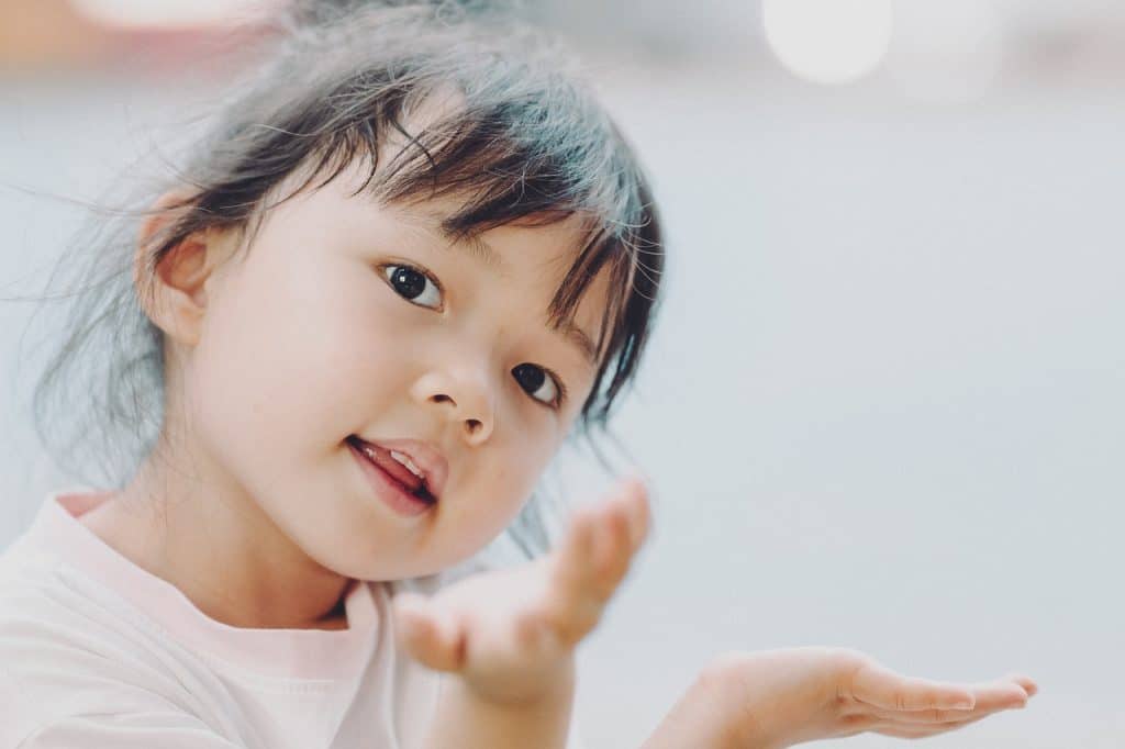 little girl showing her hands