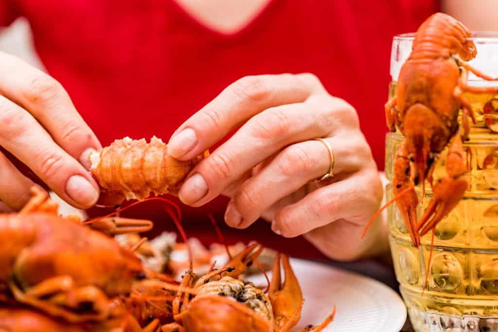 man eating crawfish