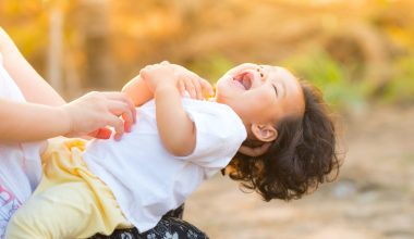 mom tickling baby
